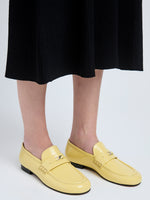 Image of model wearing Mini Monogram Loafers in Resin