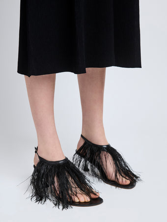 Proenza Schouler image of model wearing Tee Thong Feather Sandals in Slick Nappa in black