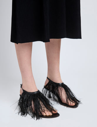 Proenza Schouler image of model wearing Tee Thong Feather Sandals in Slick Nappa in black