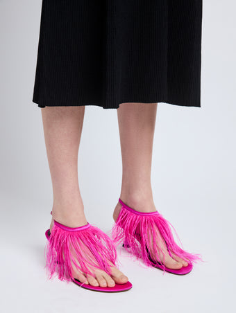 Image of model wearing Tee Thong Feather Sandals in Fuchsia