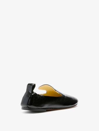 3/4 Back image of Glove Slippers in Black