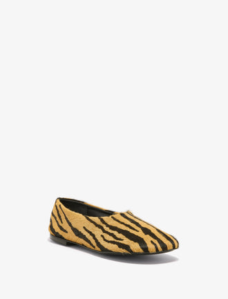 Proenza Schouler front 3/4 image of Glove Slippers in Haircalf in orange/black