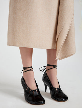 Image of model wearing Glove Hinge Pumps in Black