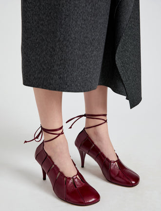 Image of model wearing Glove Hinge Pumps in Merlot