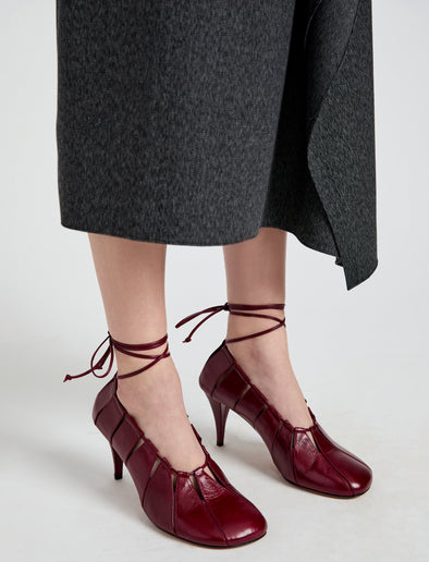 Image of model wearing Glove Hinge Pumps in Merlot