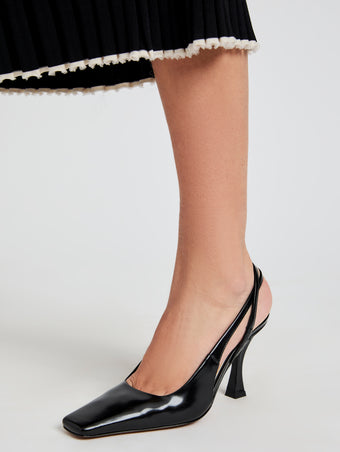 Proenza Schouler image of model wearing Trap Cross Slingback Pumps in Spazzolato Leather in Black