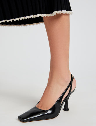 Proenza Schouler image of model wearing Trap Cross Slingback Pumps in Spazzolato Leather in Black