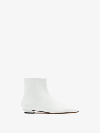 Front image of Trap Flat Ankle Boots in Spazzolato Leather in Ecru