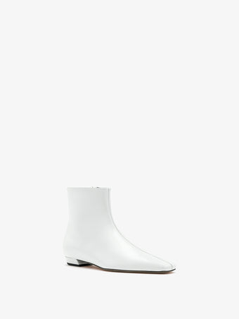 3/4 Front image of Trap Flat Ankle Boots in Spazzolato Leather in Ecru
