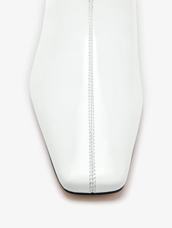 Aerial image of Trap Flat Ankle Boots in Spazzolato Leather in Ecru