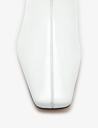 Aerial image of Trap Flat Ankle Boots in Spazzolato Leather in Ecru