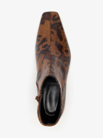 Proenza Schouler Aerial image of Trap Flat Ankle Boots In Embossed Python in Ochre Multi