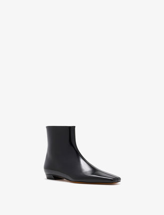 3/4 Front image of Trap Flat Ankle Boots In Nappa Leather in Black