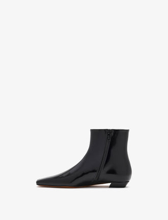 3/4 Back image of Trap Flat Ankle Boots In Nappa Leather in Black