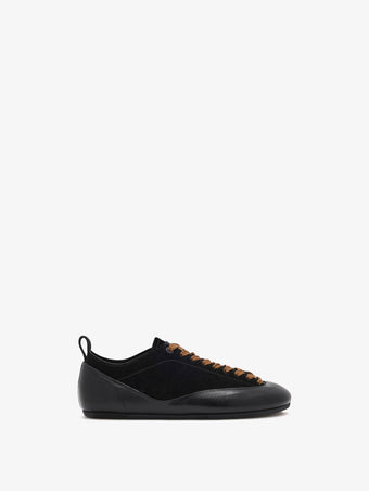Proenza Schouler side image of Arcadia Sneakers in black with tan laces