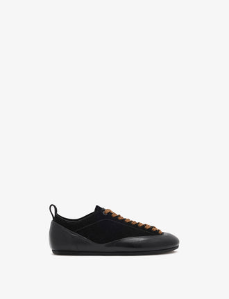 Proenza Schouler side image of Arcadia Sneakers in black with tan laces