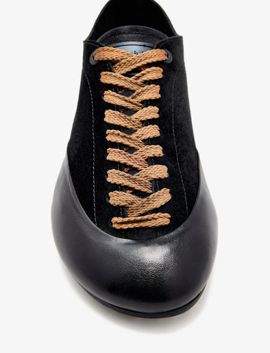 Proenza Schouler aerial image of Arcadia Sneakers in black with tan laces