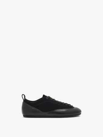 Proenza Schouler side image of Arcadia Sneakers in black with black laces