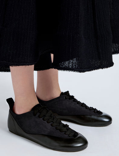 Proenza Schouler Image of model wearing Arcadia Sneakers in Black with black laces