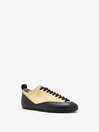 Proenza Schouler front 3/4 image of Arcadia Sneakers in Almond with black laces