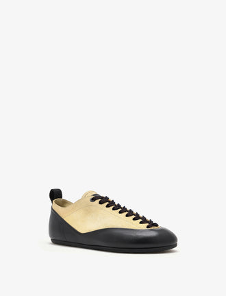 Proenza Schouler front 3/4 image of Arcadia Sneakers in Almond with black laces
