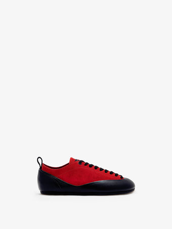 Proenza Schouler side image of Arcadia Sneakers in red with black laces