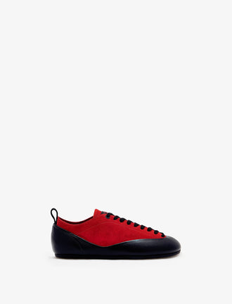 Proenza Schouler side image of Arcadia Sneakers in red with black laces