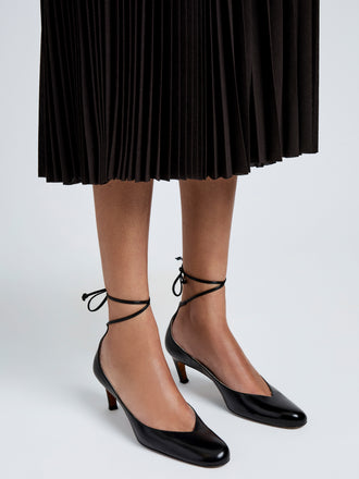 Proenza Schouler Image of model wearing Uma Tie Pumps In Slick Calf in Black