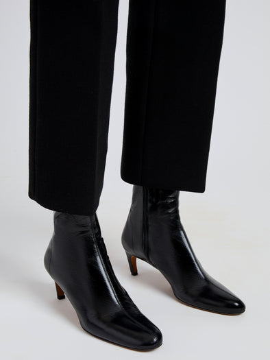 Proenza Schouler Image of model wearing Uma Ankle Boots in Slick Calf in Black