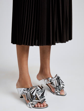 Proenza Schouler Image of model wearing Tee Souvenir Sandals in Mirror Foil in Silver