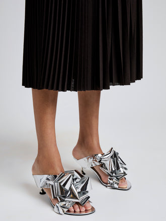Proenza Schouler Image of model wearing Tee Souvenir Sandals in Mirror Foil in Silver