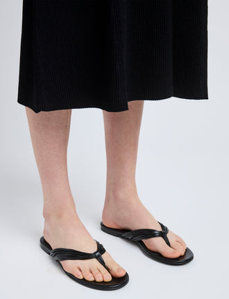 Image of model wearing Cable Thong Sandals in Black