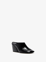 Proenza Schouler 3/4 Front image of Slant Mules in Slick Calf in Black
