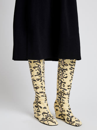 Proenza Schouler Image of model wearing Slant Boots in Embossed Python in Resin Multi