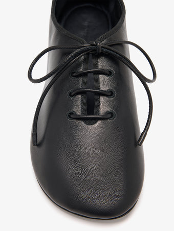 Detail image of Glove Lace Up Flats in Black 
