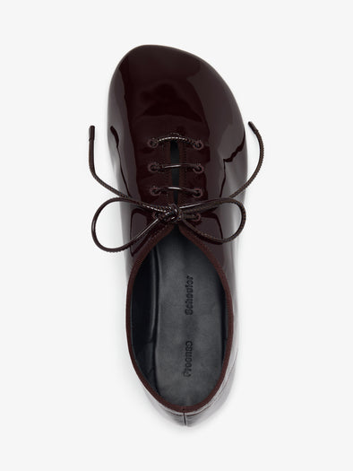 Proenza Schouler Aerial image of Glove Lace Up Flats in Soft Patent in Currant