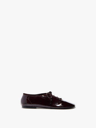 Proenza Schouler Front image of Glove Lace Up Flats in Soft Patent in Currant