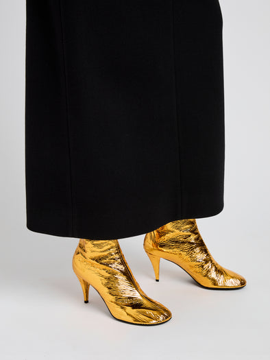 Proenza Schouler Image of model wearing Glove Ankle Boots in Crinkle Gold in Gold