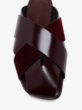 Proenza Schouler Detail image of Slant Cross Slides In Brushed Callf And Calfsuede in Merlot