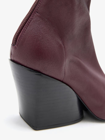 Proenza Schouler Detail image of Slant Stretch Boots in Oxblood