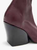 Proenza Schouler Detail image of Slant Stretch Boots in Oxblood
