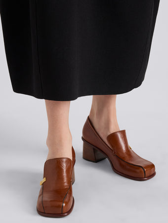Proenza Schouler Image of model wearing Esme Loafer in Nappa Latex in Cuoio