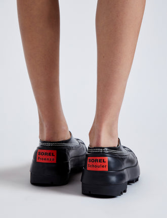 Proenza Schouler image of model wearing SOREL x Proenza Schouler CARIBOU Mule WP in BLACK/CHALK