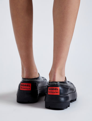 Proenza Schouler image of model wearing SOREL x Proenza Schouler CARIBOU Mule WP in BLACK/CHALK