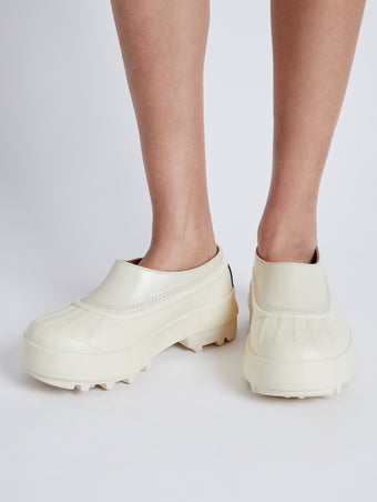 Proenza Schouler image of model wearing SOREL x Proenza Schouler CARIBOU Mule WP in CHALK/BLACK