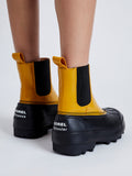 Proenza Schouler image of model wearing SOREL x Proenza Schouler CARIBOU Chelsea WP in GOLDEN OCHRE/BLACK