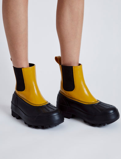 Proenza Schouler image of model wearing SOREL x Proenza Schouler CARIBOU Chelsea WP in GOLDEN OCHRE/BLACK