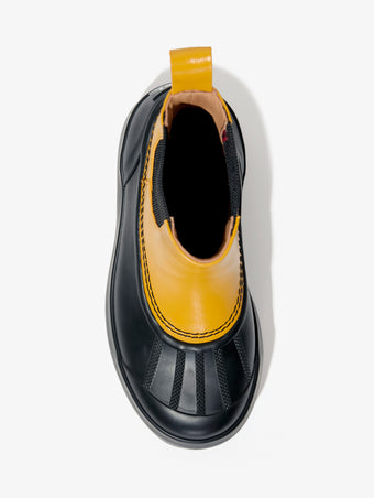 Proenza Schouler aerial image of SOREL x Proenza Schouler CARIBOU Chelsea WP in GOLDEN OCHRE/BLACK