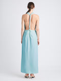 Back image of model wearing Selena Twist Back Dress in Matte Viscose Crepe in pale blue