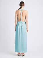 Back image of model wearing Selena Twist Back Dress in Matte Viscose Crepe in pale blue